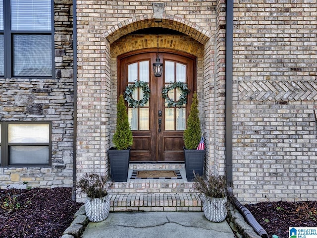 view of exterior entry featuring french doors