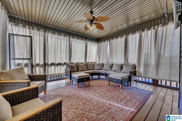 sunroom featuring ceiling fan