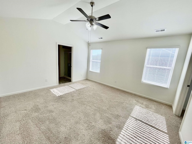 interior space featuring ceiling fan and vaulted ceiling