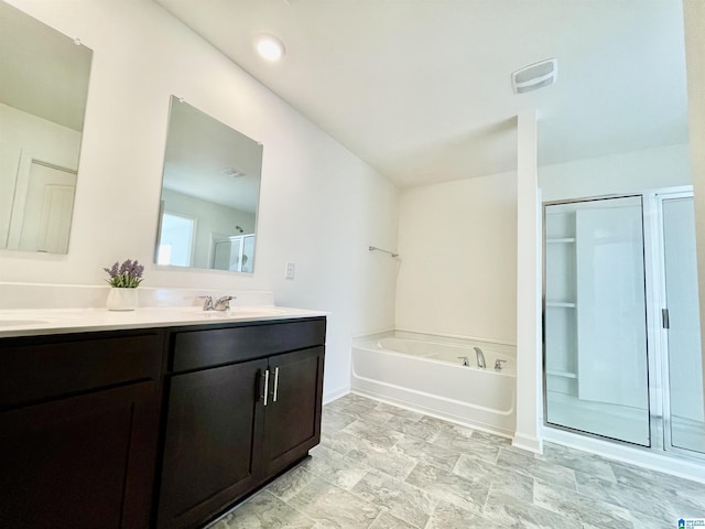 bathroom featuring vanity and plus walk in shower