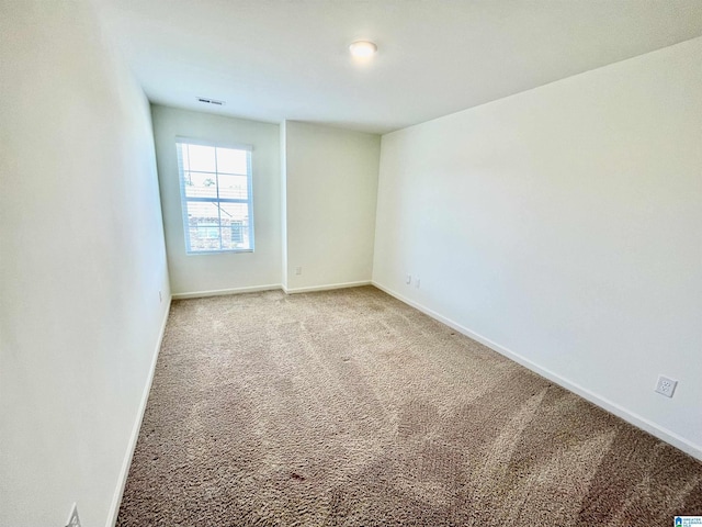 spare room featuring carpet floors