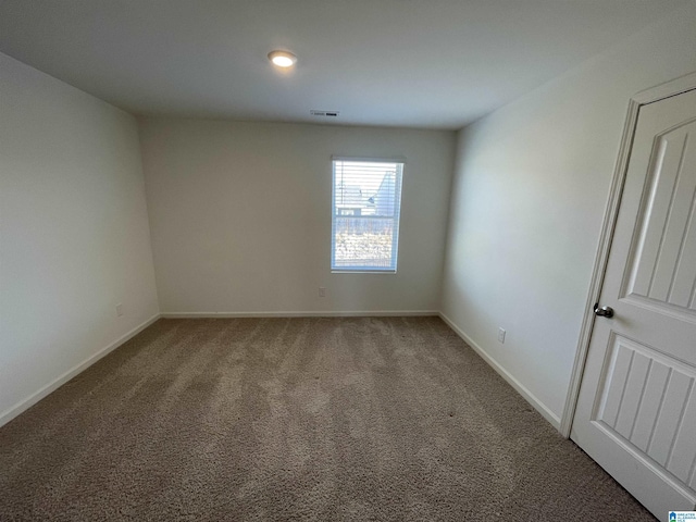 spare room featuring carpet floors