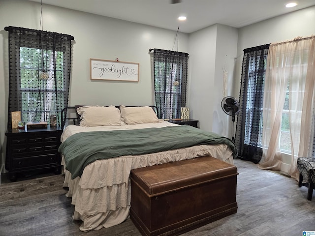 bedroom with wood finished floors and recessed lighting