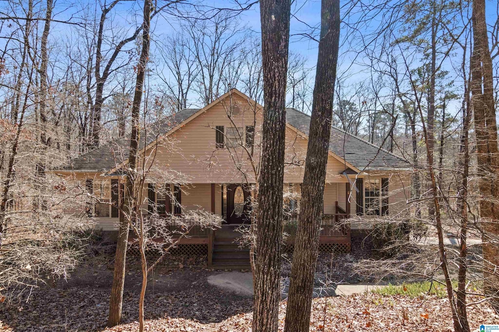 rear view of house with a porch