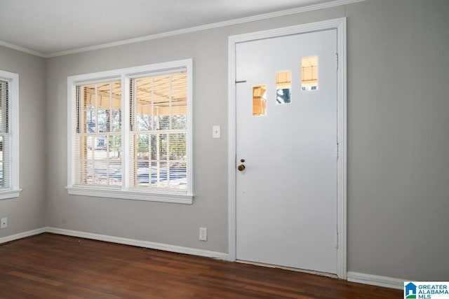 doorway with ornamental molding and dark hardwood / wood-style floors