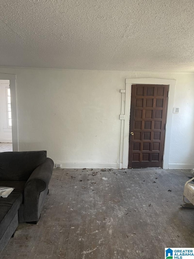 unfurnished living room with a textured ceiling