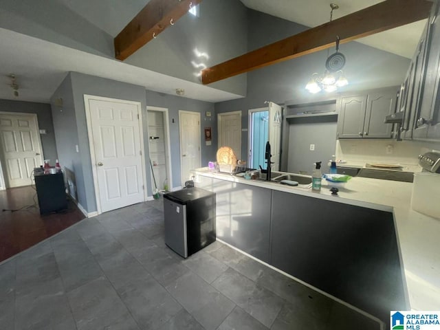 kitchen with high vaulted ceiling, decorative light fixtures, beamed ceiling, sink, and gray cabinetry