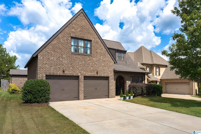 view of front of property featuring a garage and a front yard