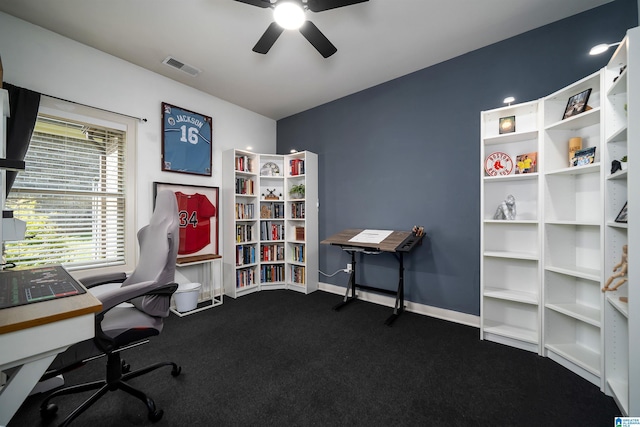 office space with ceiling fan and dark carpet