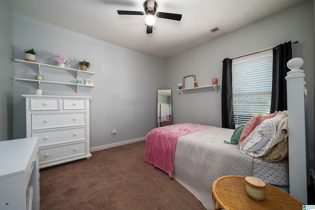 bedroom with dark colored carpet and ceiling fan