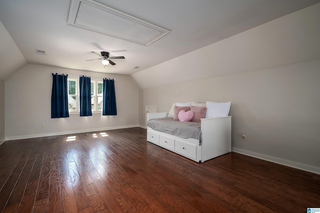 unfurnished bedroom with ceiling fan, dark hardwood / wood-style flooring, and vaulted ceiling