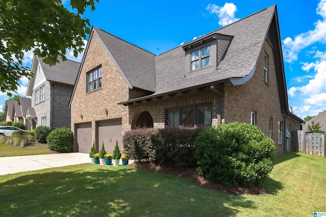 view of front facade featuring a garage and a front lawn