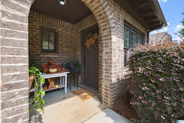 doorway to property with a porch