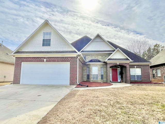 view of front of property featuring a garage and a front yard