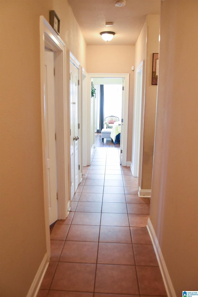 hallway featuring light tile patterned floors