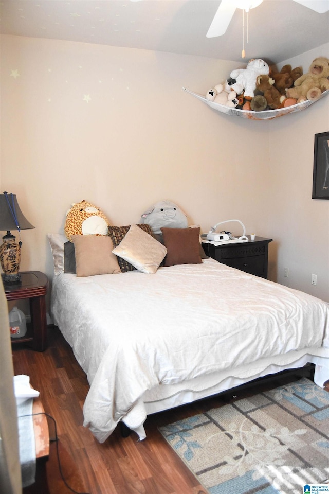 bedroom featuring dark wood-type flooring and ceiling fan