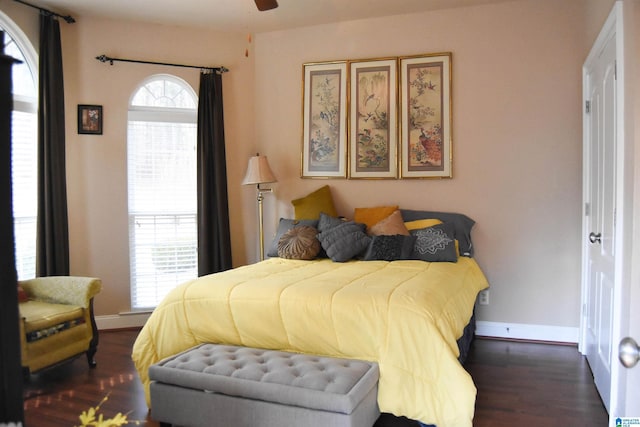 bedroom with dark wood-type flooring and ceiling fan