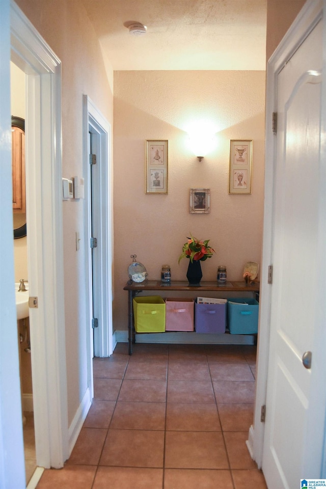 corridor with tile patterned flooring