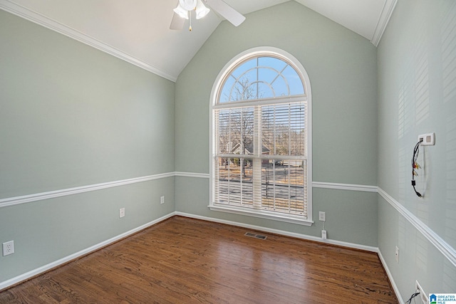 spare room featuring hardwood / wood-style flooring, ceiling fan, and lofted ceiling