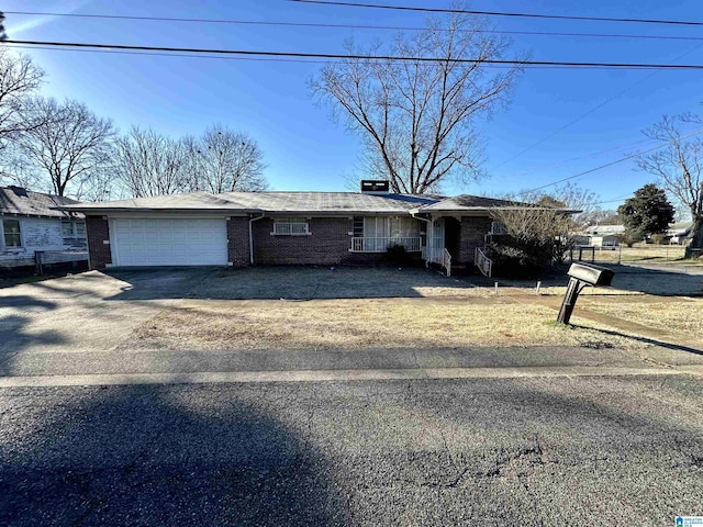 single story home featuring a garage