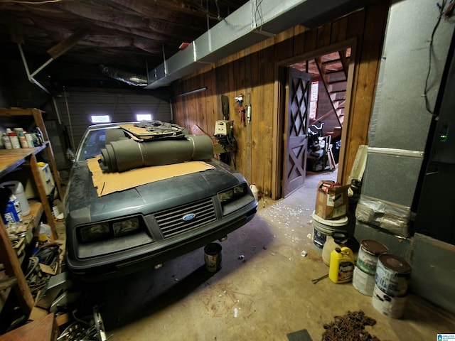 garage featuring wooden walls