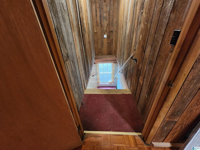 stairs featuring parquet floors