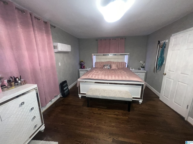 bedroom featuring dark hardwood / wood-style flooring