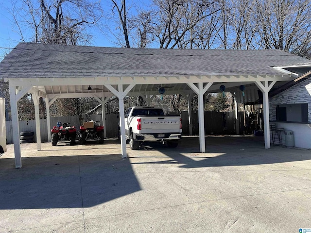 view of parking / parking lot with a carport