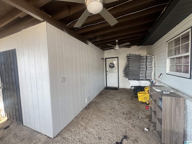 property entrance with ceiling fan