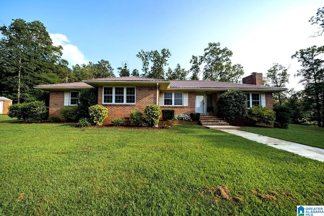 ranch-style home featuring a front yard