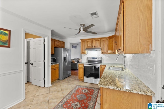 kitchen with appliances with stainless steel finishes, sink, decorative backsplash, light stone counters, and crown molding