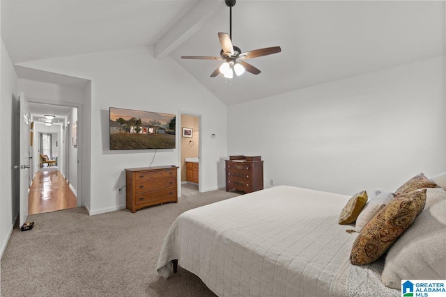 bedroom with ensuite bathroom, vaulted ceiling with beams, light carpet, and ceiling fan