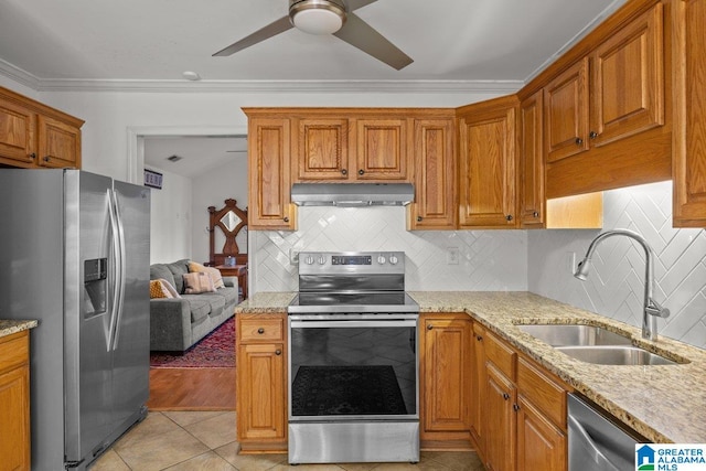 kitchen with sink, light tile patterned floors, appliances with stainless steel finishes, backsplash, and ornamental molding