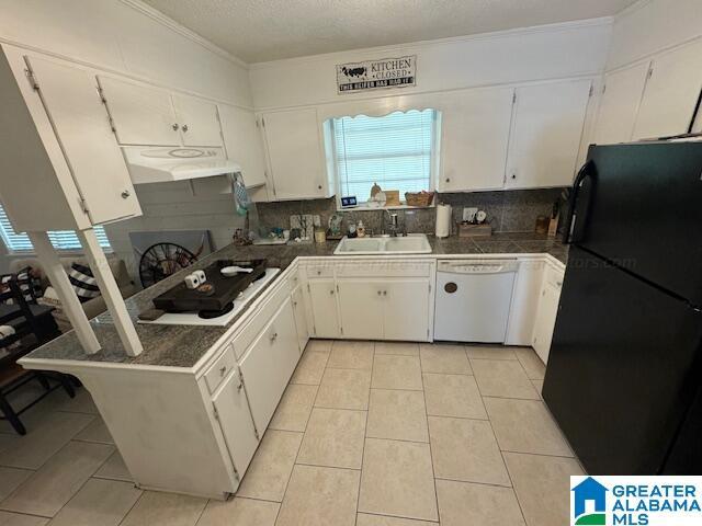 kitchen with sink, white appliances, white cabinets, and light tile patterned flooring