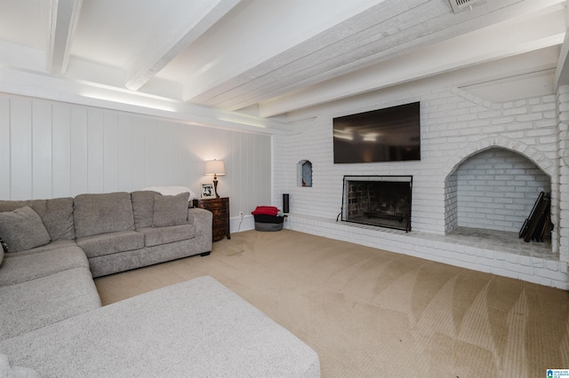 living room featuring light carpet, a brick fireplace, and beam ceiling