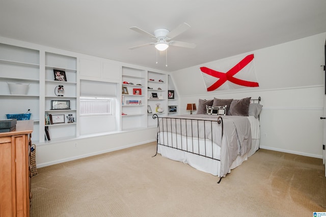 carpeted bedroom with vaulted ceiling and ceiling fan