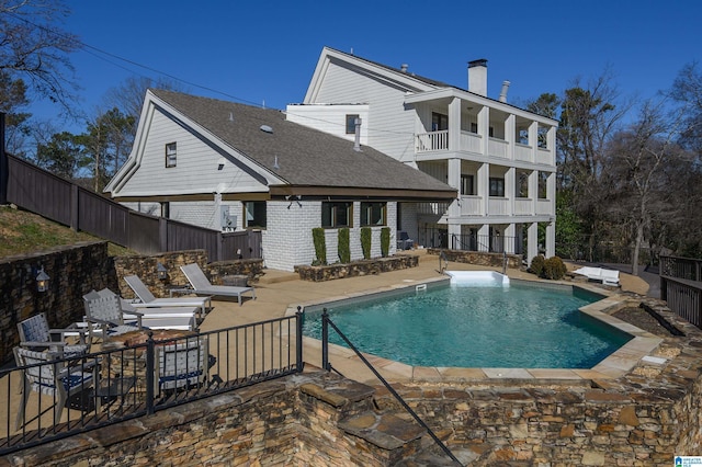 view of pool featuring a hot tub and a patio