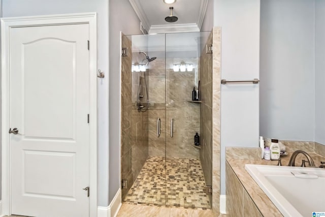 bathroom with sink, ornamental molding, and separate shower and tub