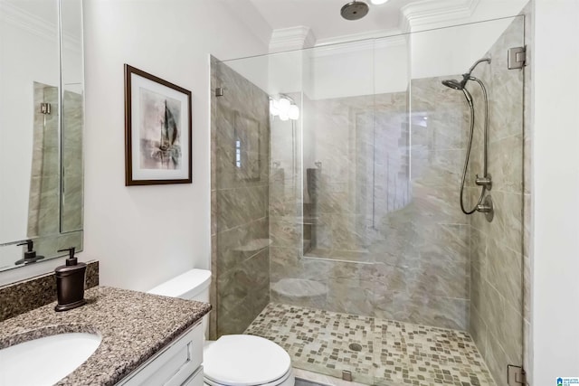 bathroom featuring vanity, ornamental molding, walk in shower, and toilet