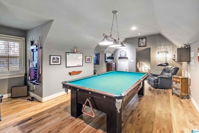 rec room featuring billiards, light hardwood / wood-style floors, and vaulted ceiling