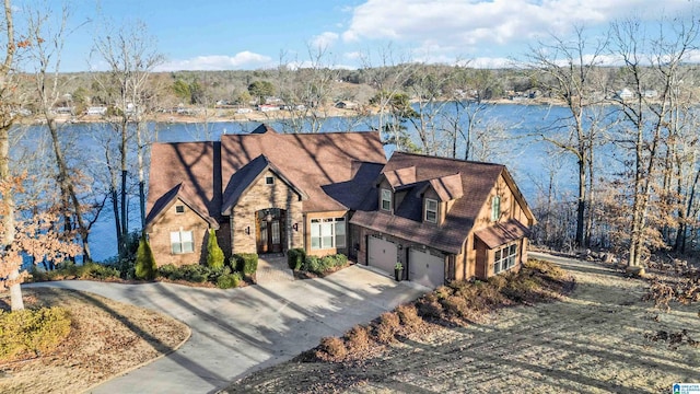 view of front of house with a water view and a garage