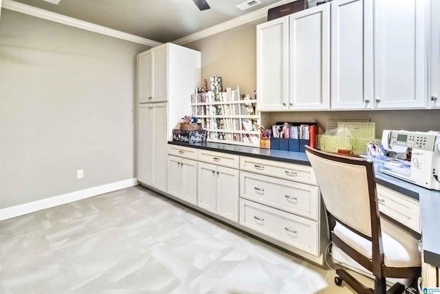 carpeted home office featuring crown molding