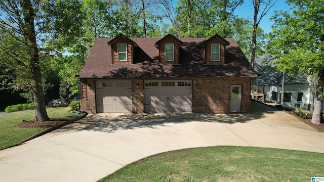 705 Lakeview Crest Dr, Pell City, AL 35128 - view of front of property with a shingled roof, driveway, a front yard, and brick siding