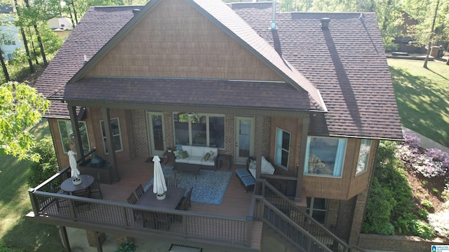 705 Lakeview Crest Dr, Pell City, AL 35128 - back of house with brick siding, a deck, a yard, and roof with shingles
