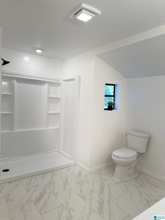 bathroom with a shower and toilet