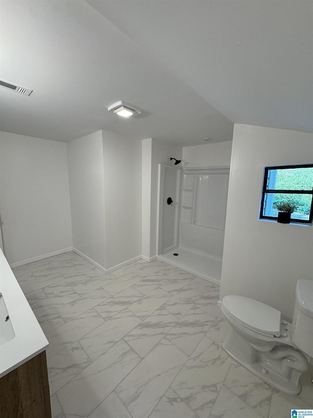 bathroom with vanity, toilet, and walk in shower