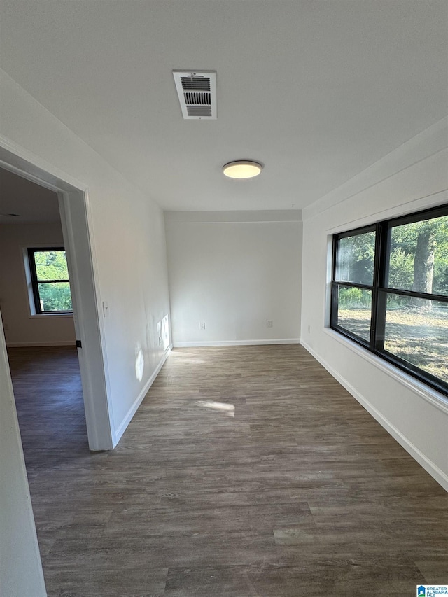 empty room featuring dark wood-type flooring