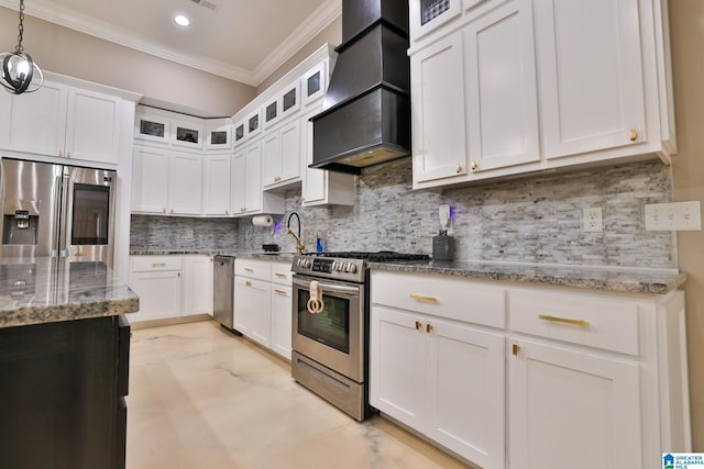 kitchen with white cabinets, backsplash, hanging light fixtures, stainless steel appliances, and custom range hood