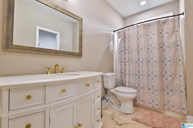 bathroom featuring vanity, toilet, and curtained shower