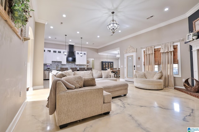 living room with a notable chandelier and ornamental molding